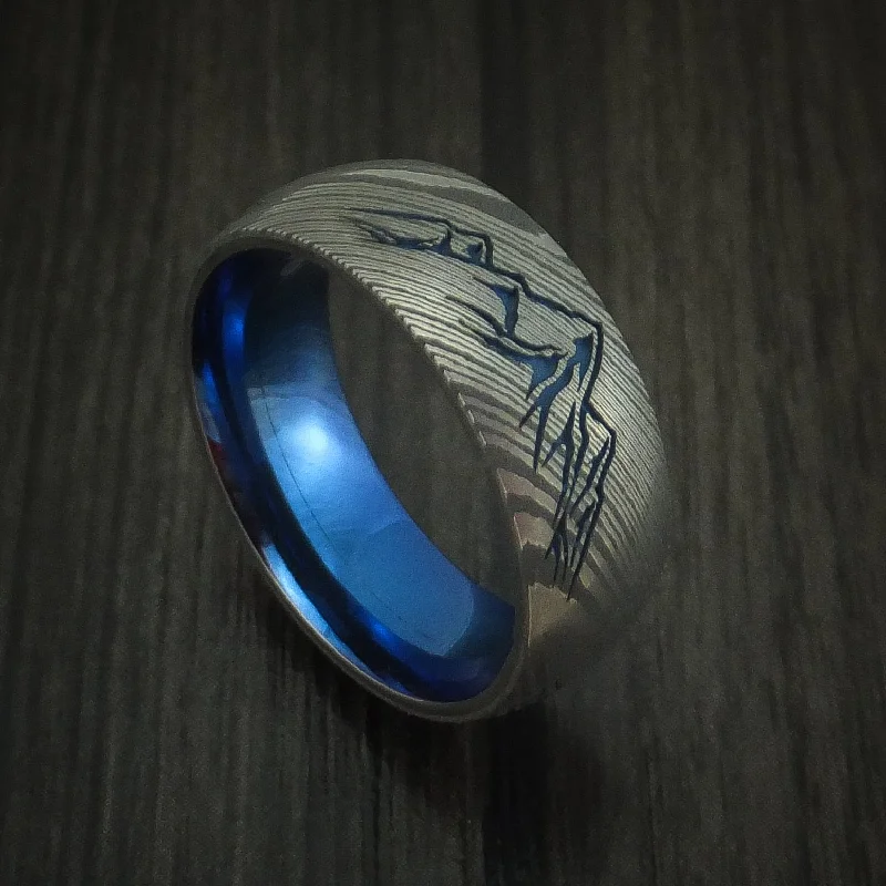 Damascus Steel Men's Ring with Mountain Range and Anodized Titanium Interior Sleeve Custom Made